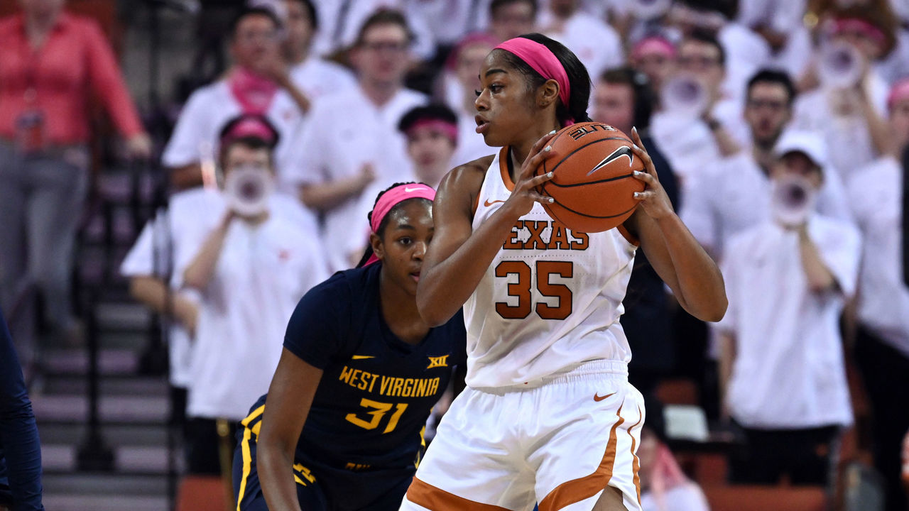 AUSTIN, TX - FEBRUARY 17: Texas Longhorns forward Charli Collier (35) is defended by West Virginia Mountaineers Lucky Rudd (4) and Rochelle Norris (31) on February 17, 2020, at the Frank Erwin Center in Austin, TX.
