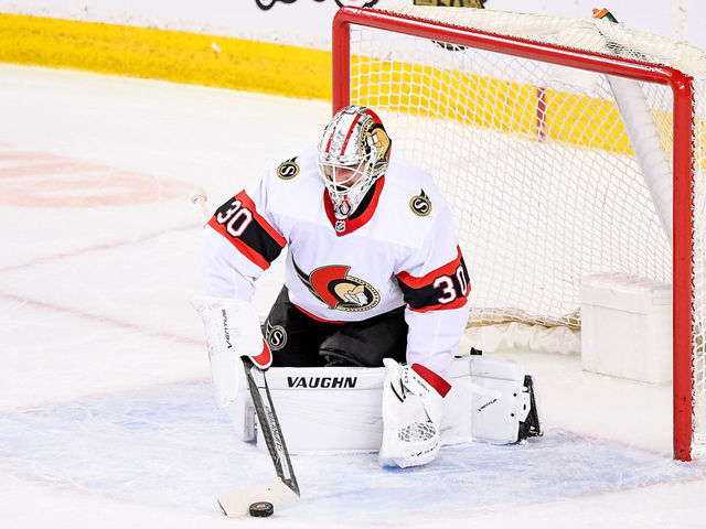 CALGARY, AB - MARCH 07: Ottawa Senators Goalie Matt Murray (30) plays the puck during the first period of an NHL game where the Calgary Flames hosted the Ottawa Senators on March 7, 2021, at the Scotiabank Saddledome in Calgary, AB.