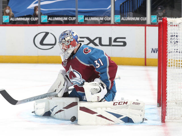 DENVER, COLORADO - MARCH 10: Goaltender Philipp Grubauer #31 of the Colorado Avalanche makes save against the Arizona Coyotes at Ball Arena on March 10, 2021 in Denver, Colorado. The Avalanche defeated the Coyotes 2-1 in overtime.