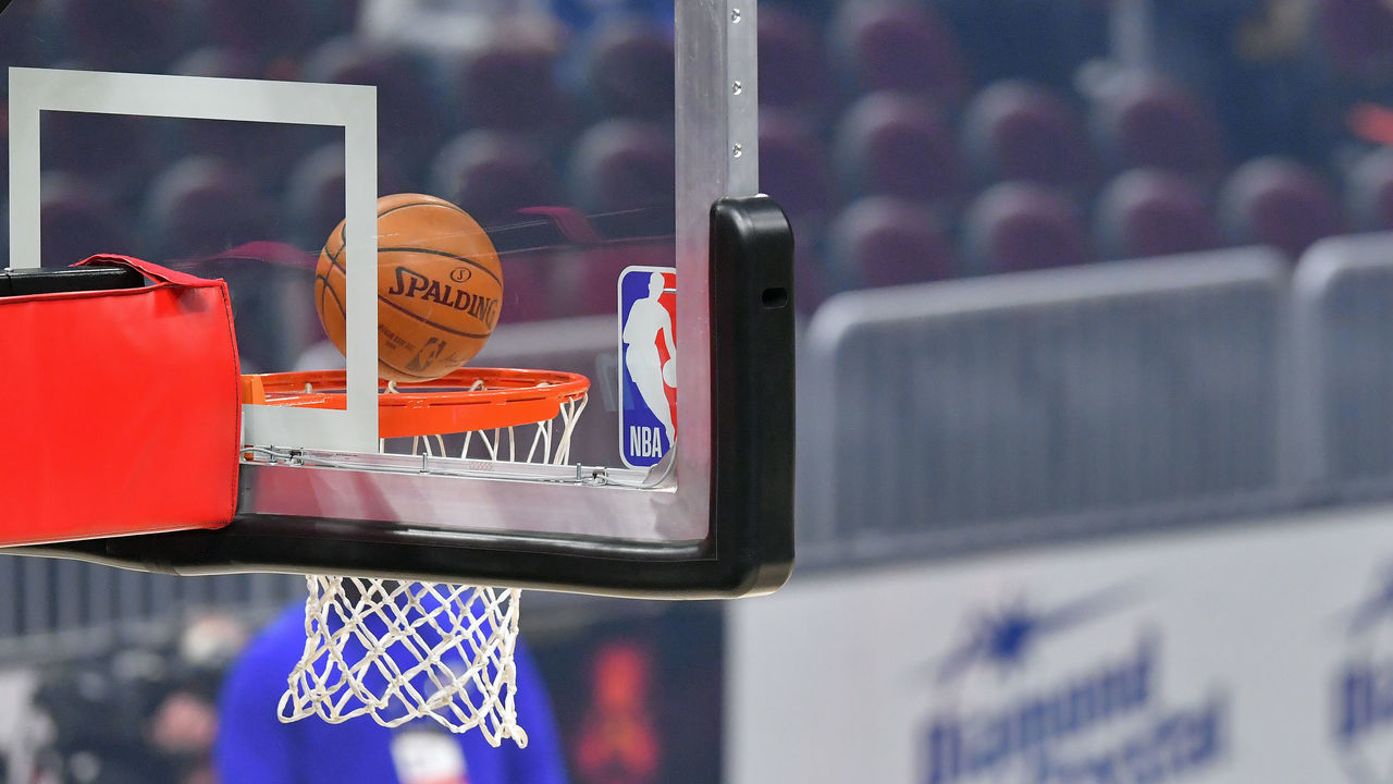 CLEVELAND, OHIO - APRIL 01: An official Spalding basketball falls through the rim next to the NBA logo on a backboard prior to the game between the Cleveland Cavaliers and the Philadelphia 76ers at Rocket Mortgage Fieldhouse on April 01, 2021 in Cleveland, Ohio. NOTE TO USER: User expressly acknowledges and agrees that, by downloading and/or using this photograph, user is consenting to the terms and conditions of the Getty Images License Agreement.