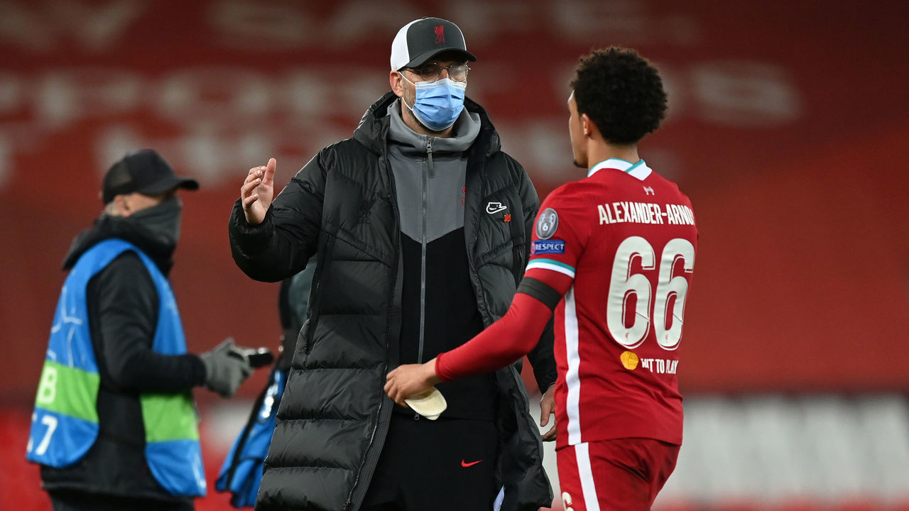 LIVERPOOL, ENGLAND - APRIL 14: Jurgen Klopp, Manager of Liverpool shakes hands with Trent Alexander-Arnold of Liverpool following the UEFA Champions League Quarter Final Second Leg match between Liverpool FC and Real Madrid at Anfield on April 14, 2021 in Liverpool, England. Sporting stadiums around the UK remain under strict restrictions due to the Coronavirus Pandemic as Government social distancing laws prohibit fans inside venues resulting in games being played behind closed doors.