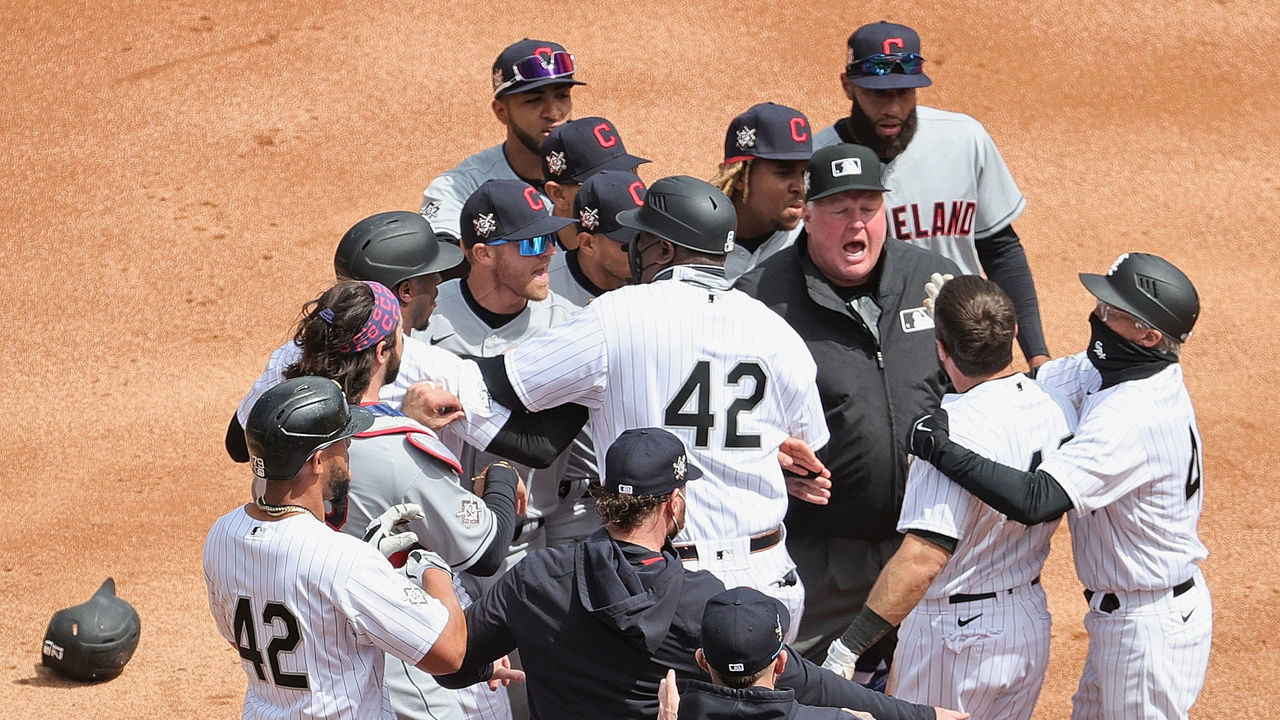 CHICAGO, ILLINOIS - APRIL 15: Players for the Cleveland Indians converge at second base during a 1st inning argument between players for the Indians and the Chicago White Sox at Guaranteed Rate Field on April 15, 2021 in Chicago, Illinois. All players are wearing the number 42 in honor of Jackie Robinson Day.