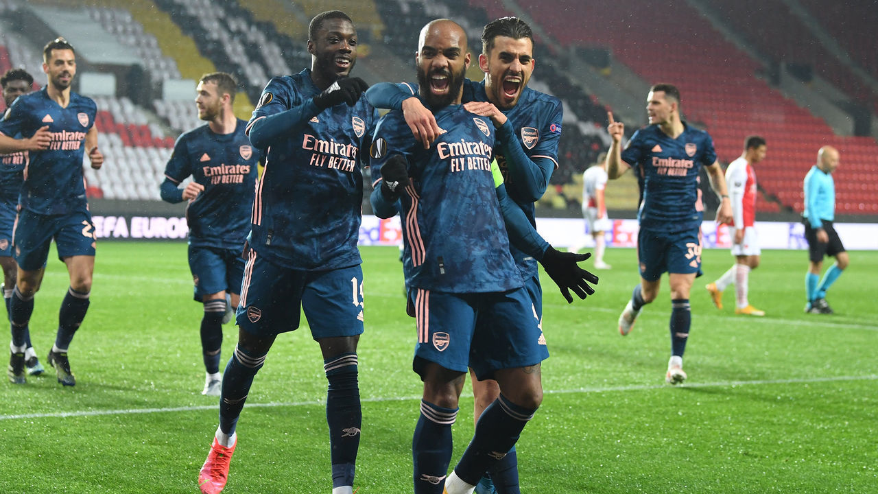 PRAGUE, CZECH REPUBLIC - APRIL 15: (2ndL) Alex Lacazette celebrates scoring the 2nd Arsenal goal with (L) Nicolas Pepe and (R) Dani Ceballos during the UEFA Europa League Quarter Final Second Leg match between Slavia Praha and Arsenal FC at Sinobo Stadium on April 15, 2021 in Prague, Czech Republic. Sporting stadiums around Europe remain under strict restrictions due to the Coronavirus Pandemic as Government social distancing laws prohibit fans inside venues resulting in games being played behind closed doors.