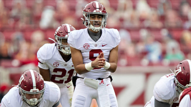 FAYETTEVILLE, AR - DECEMBER 12: Bryce Young #9 of the Alabama Crimson Tide waits for the snap during a game against the Arkansas Razorbacks at Razorback Stadium on December 12, 2020 in Fayetteville, Arkansas. The Crimson Tide defeated the Razorbacks 52-3.