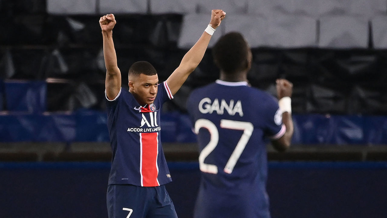 (From L) Paris Saint-Germain's French forward Kylian Mbappe, Paris Saint-Germain's Senegalese midfielder Idrissa Gueye celebrate after qualifying at the end of the UEFA Champions League quarter-final second leg football match between Paris Saint-Germain (PSG) and FC Bayern Munich at the Parc des Princes stadium in Paris, on April 13, 2021.