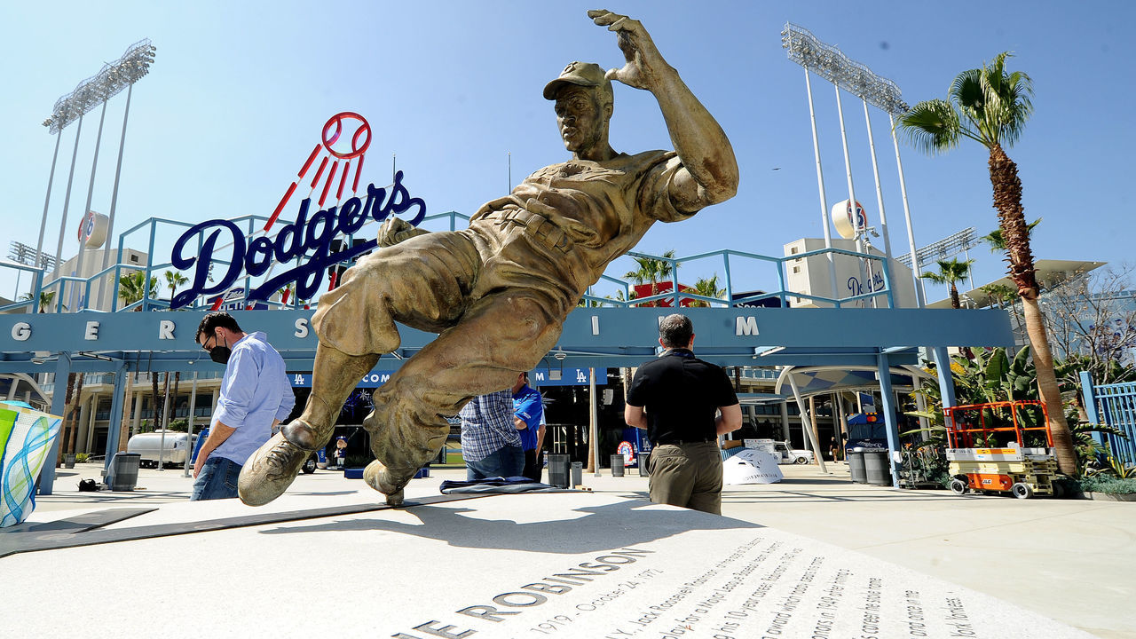 LOS ANGEL;ES, CALIFORNIA APRIL 7, 2021-A statue of baseball legend Jackie Robinson sits in the outfield beyond the bleachers as the Dodgers prepare for opening day at Dodger Stadium. (Wally Skalij/Los Angeles Times via Getty Images)