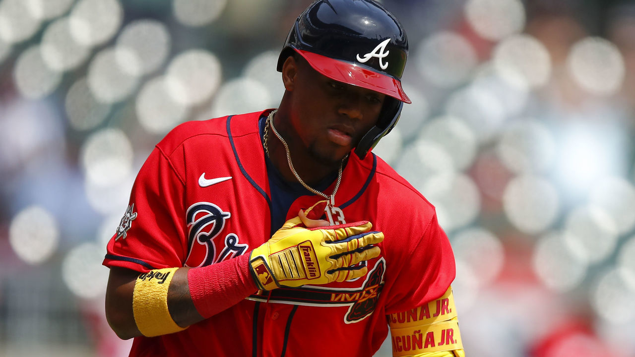 ATLANTA, GA - APRIL 15: Ronald Acuna Jr. #13 of the Atlanta Braves reacts after hitting a two run home run in the fifth inning of an MLB game against the Miami Marlins at Truist Park on April 15, 2021 in Atlanta, Georgia. All players are wearing the number 42 in honor of Jackie Robinson Day.
