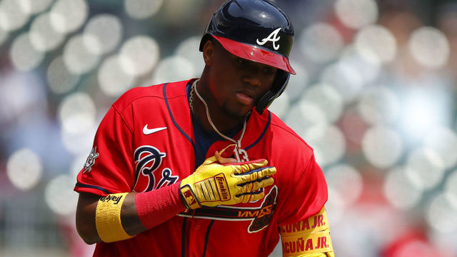 ATLANTA, GA - APRIL 15: Ronald Acuna Jr. #13 of the Atlanta Braves reacts after hitting a two run home run in the fifth inning of an MLB game against the Miami Marlins at Truist Park on April 15, 2021 in Atlanta, Georgia. All players are wearing the number 42 in honor of Jackie Robinson Day.