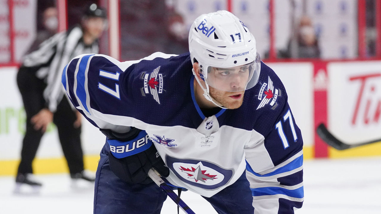 OTTAWA, ON - APRIL 12: Adam Lowry #17 of the Winnipeg Jets skates against the Ottawa Senators at Canadian Tire Centre on April 12, 2021 in Ottawa, Ontario, Canada.