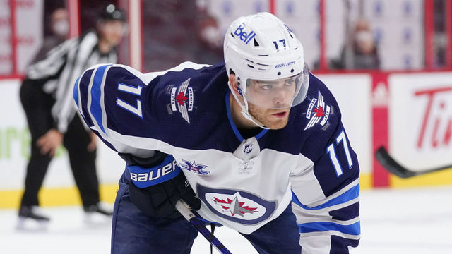 OTTAWA, ON - APRIL 12: Adam Lowry #17 of the Winnipeg Jets skates against the Ottawa Senators at Canadian Tire Centre on April 12, 2021 in Ottawa, Ontario, Canada.