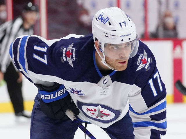 OTTAWA, ON - APRIL 12: Adam Lowry #17 of the Winnipeg Jets skates against the Ottawa Senators at Canadian Tire Centre on April 12, 2021 in Ottawa, Ontario, Canada.