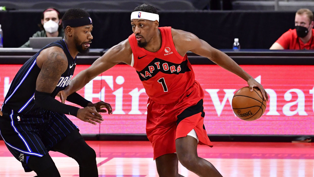 TAMPA, FLORIDA - APRIL 16: Paul Watson #1 of the Toronto Raptors dribbles the ball as Terrence Ross #31 of the Orlando Magic defends during the third quarter at Amalie Arena on April 16, 2021 in Tampa, Florida.
