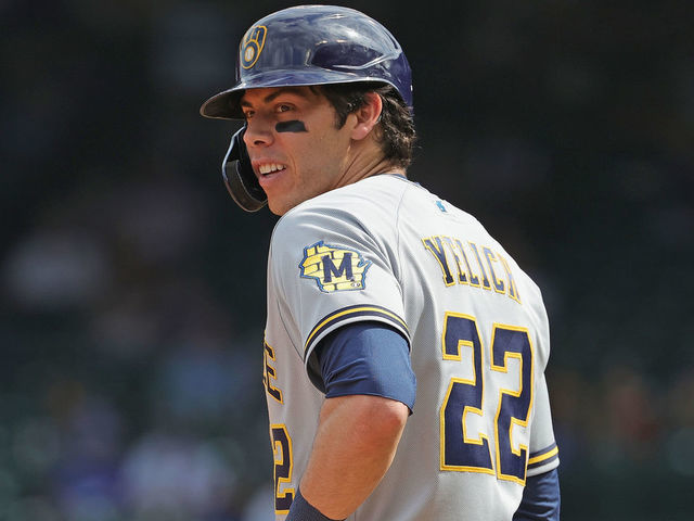 CHICAGO, ILLINOIS - APRIL 07: Christian Yelich #22 of the Milwaukee Brewers stands at third base against the Chicago Cubs at Wrigley Field on April 07, 2021 in Chicago, Illinois. The Brewers defeated the Cubs 4-2 in 10 innings.