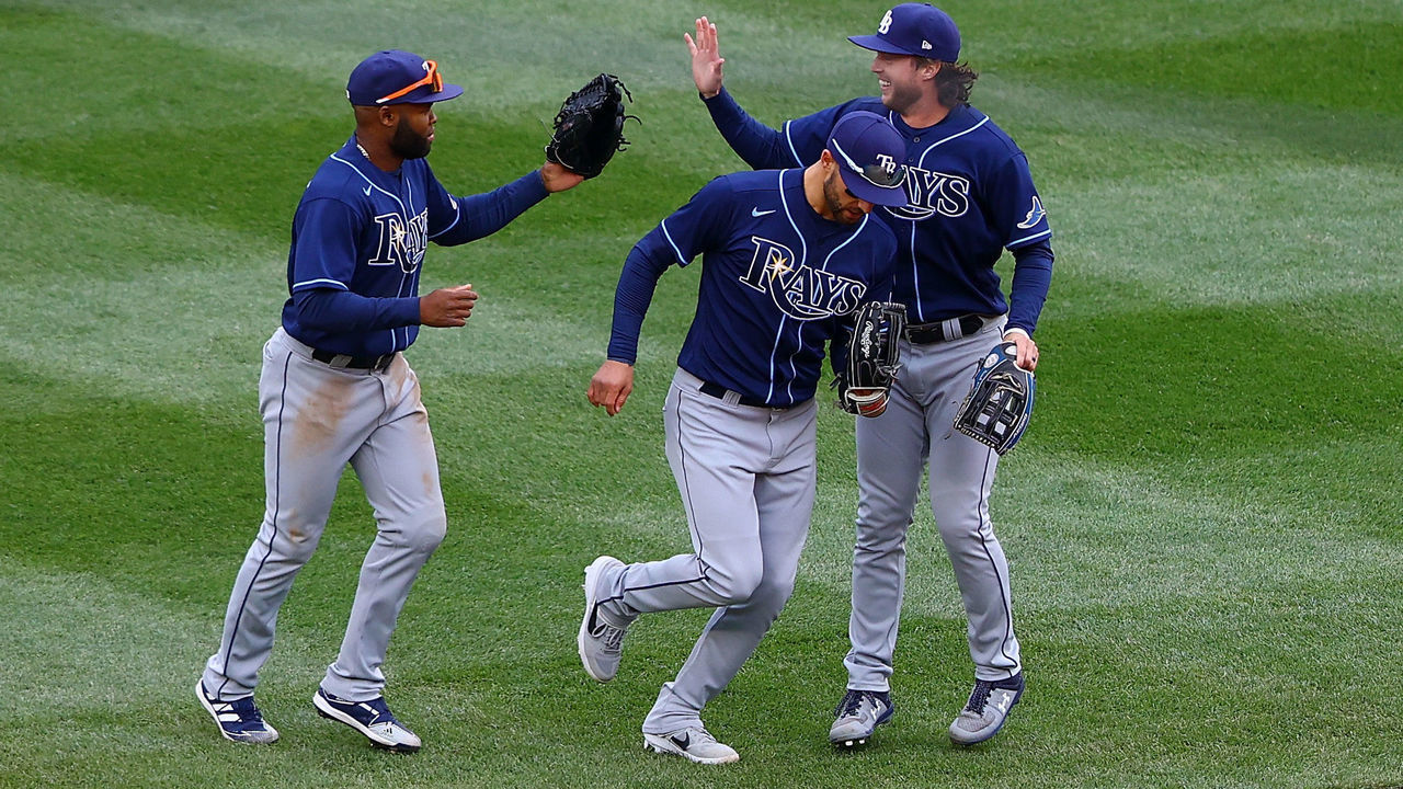 NEW YORK, NEW YORK - APRIL 17: Brett Phillips #35, Manuel Margot #13 and Randy Arozarena #56 of the Tampa Bay Rays celebrates after defeating the New York Yankees 6-3 at Yankee Stadium on April 17, 2021 in New York City.
