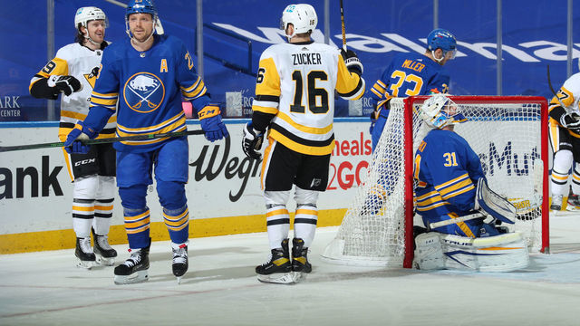 BUFFALO, NY - APRIL 17: Jared McCann #19 of the Pittsburgh Penguins scores a goal against Dustin Tokarski #31 of the Buffalo Sabres during the first period of an NHL game on April 17, 2021 at KeyBank Center in Buffalo, New York.