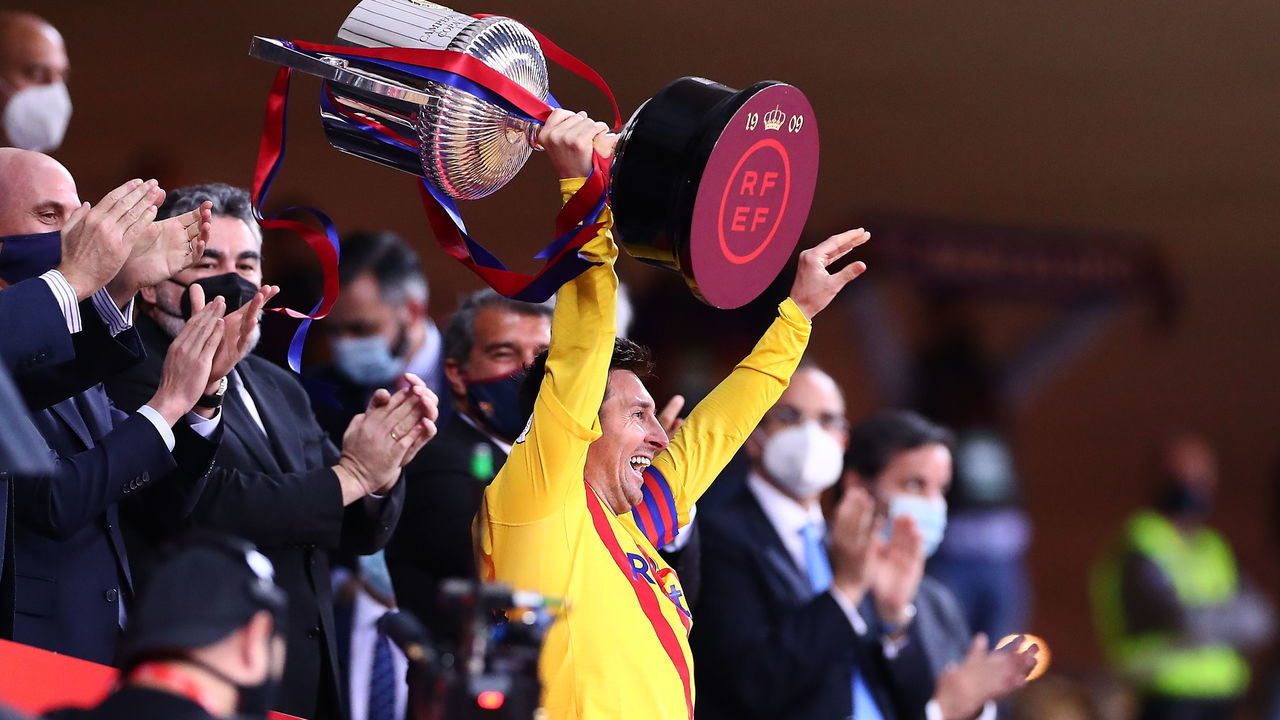 SEVILLE, SPAIN - APRIL 17: Lionel Messi of FC Barcelona lifts the trophy after winning the Copa del Rey Final match between Athletic Club and Barcelona at Estadio de La Cartuja on April 17, 2021 in Seville, Spain. Sporting stadiums around Spain remain under strict restrictions due to the Coronavirus Pandemic as Government social distancing laws prohibit fans inside venues resulting in games being played behind closed doors.