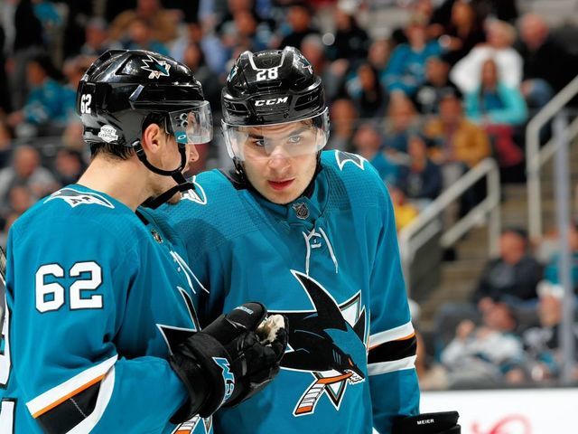 SAN JOSE, CA - FEBRUARY 13: Kevin Labanc #62 and Timo Meier #28 of the San Jose Sharks chat during a NHL game against the Arizona Coyotes at SAP Center on February 13, 2018 in San Jose, California.