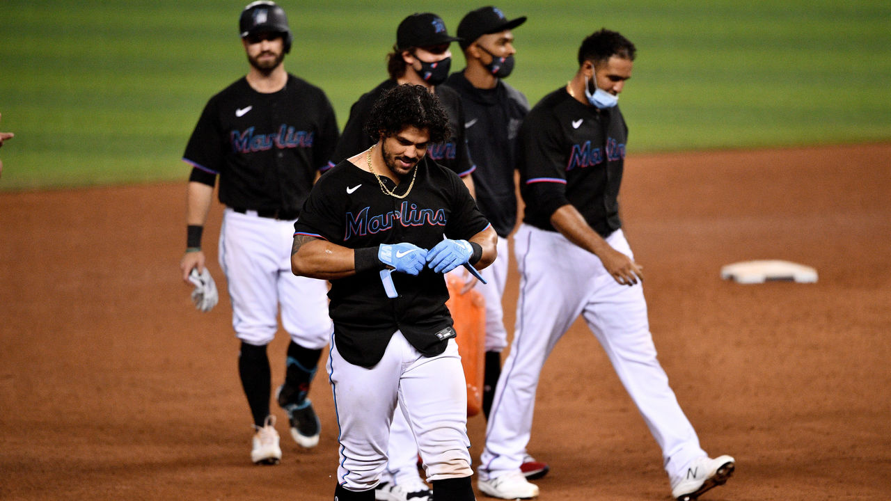 Miami Marlins' Jorge Alfaro is hit by a pitch during the ninth