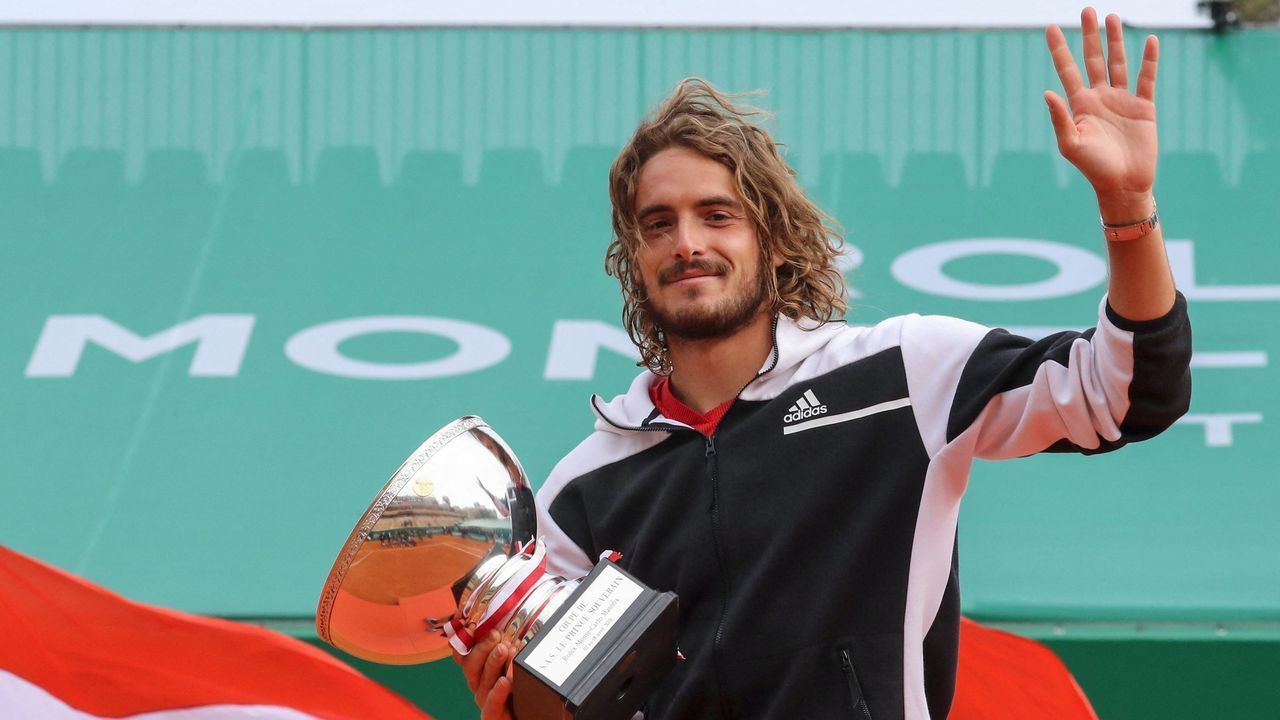 Greece's Stefanos Tsitsipas poses for pictures with the trophy after winning the final singles match against Russia's Andrey Rublev on day nine of the Monte-Carlo ATP Masters Series tennis tournament in Monaco on April 18, 2021.