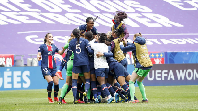 LYON, FRANCE - APRIL 18: Marie-Antoinette Katoto #9 of Paris Saint-Germain (top left) celebrates the victory with her teammates after the Second Leg of the UEFA Women's Champions League Quarter Final match between Olympique Lyonnais and Paris Saint-Germain at Groupama Stadium on April 18, 2021 in Lyon, France. Sporting stadiums around France remain under strict restrictions due to the Coronavirus Pandemic as Government social distancing laws prohibit fans inside venues resulting in games being played behind closed doors.