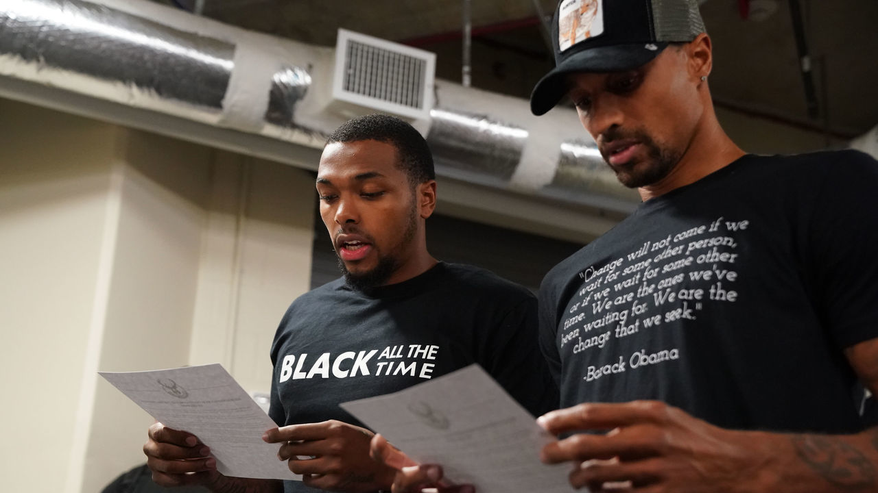 ORLANDO, FL - AUGUST 26: Sterling Brown and George Hill of the Milwaukee Bucks reads a statement to the media on August 26, 2020 at AdventHealth Arena at ESPN Wide World of Sports Complex in Orlando, Florida. NOTE TO USER: User expressly acknowledges and agrees that, by downloading and/or using this photograph, user is consenting to the terms and conditions of the Getty Images License Agreement. Mandatory Copyright Notice: Copyright 2020 NBAE