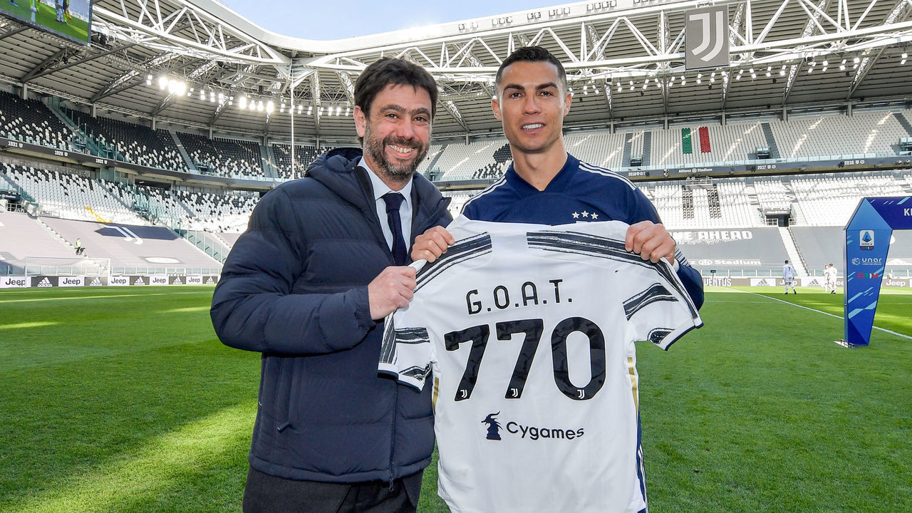 TURIN, ITALY - MARCH 21: Juventus' president Andrea Agnelli awarded Cristiano Ronaldo with a special shirt, created to celebrate 770 goals scored in his career prior to the Serie A match between Juventus and Benevento Calcio at Allianz Stadium on March 21, 2021 in Turin, Italy.