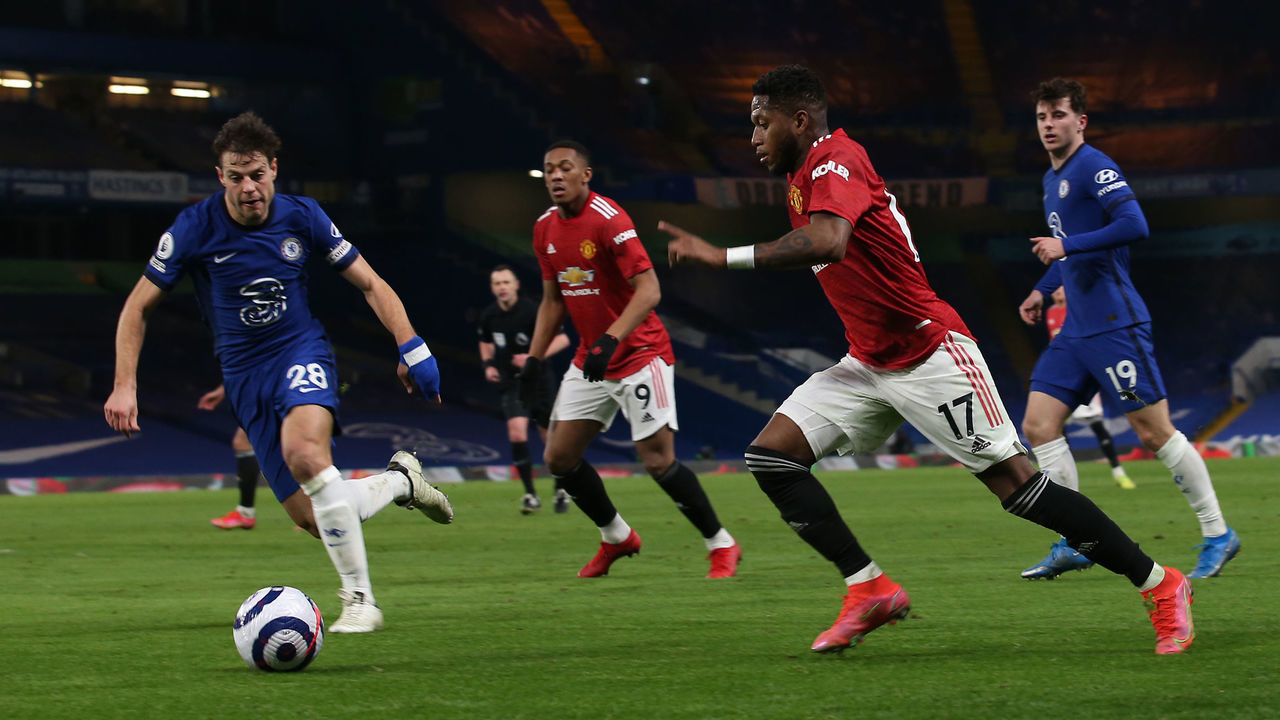LONDON, ENGLAND - FEBRUARY 28: Fred of Manchester United in action with Cesar Azpilicueta of Chelsea during the Premier League match between Chelsea and Manchester United at Stamford Bridge on February 28, 2021 in London, England. Sporting stadiums around the UK remain under strict restrictions due to the Coronavirus Pandemic as Government social distancing laws prohibit fans inside venues resulting in games being played behind closed doors.