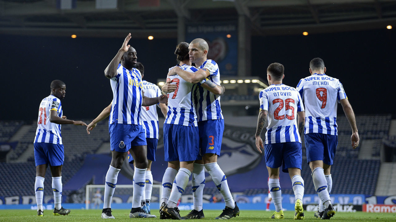 PORTO, PORTUGAL - APRIL 03: Sergio Oliveira of FC Porto celebrates with teammates after scores his sides first goal during the Liga NOS match between FC Porto and CD Santa Clara at Estadio do Dragao on April 3, 2021 in Porto, Portugal. Sporting stadiums around Portugal remain under strict restrictions due to the coronavirus pandemic as government social distancing laws prohibit fans inside venues resulting in games being played behind closed doors.