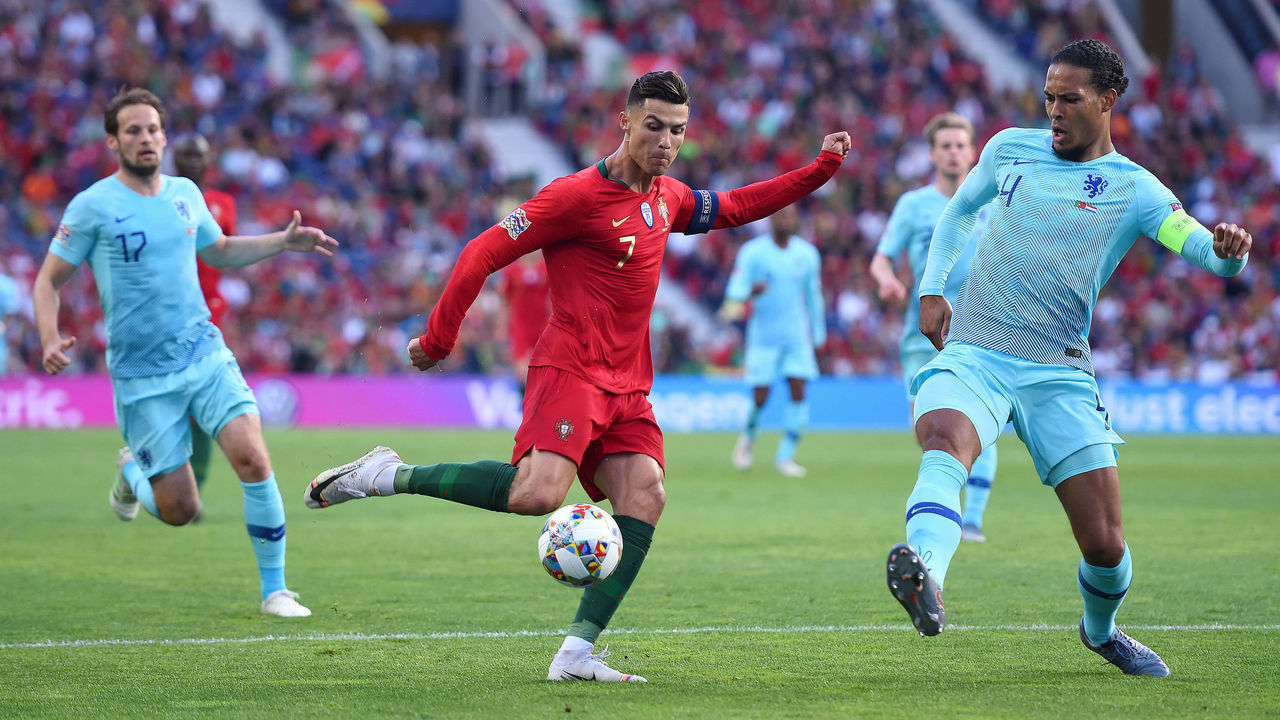 PORTO, PORTUGAL - JUNE 09: Cristiano Ronaldo of Portugal is challenged by Virgil van Dijk of the Netherlands during the UEFA Nations League Final between Portugal and the Netherlands at Estadio do Dragao on June 09, 2019 in Porto, Portugal.