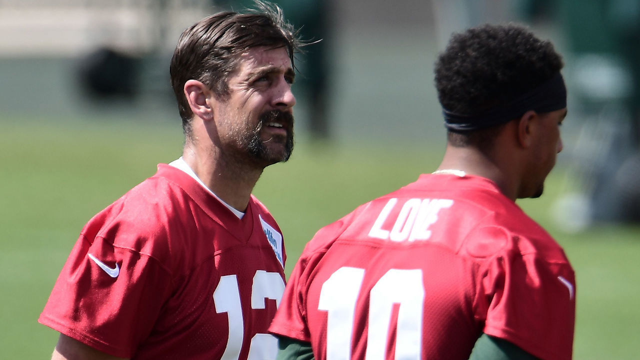 ASHWAUBENON, WISCONSIN - AUGUST 17: Aaron Rodgers #12 of the Green Bay Packers stands with Jordan Love #10 during training camp at Ray Nitschke Field on August 17, 2020 in Ashwaubenon, Wisconsin.