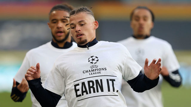 LEEDS, ENGLAND - APRIL 19: Kalvin Phillips of Leeds United warms up while wearing a protest t-shirt reading "Champions League, Earn it." prior to the Premier League match between Leeds United and Liverpool at Elland Road on April 19, 2021 in Leeds, England. Sporting stadiums around the UK remain under strict restrictions due to the Coronavirus Pandemic as Government social distancing laws prohibit fans inside venues resulting in games being played behind closed doors.