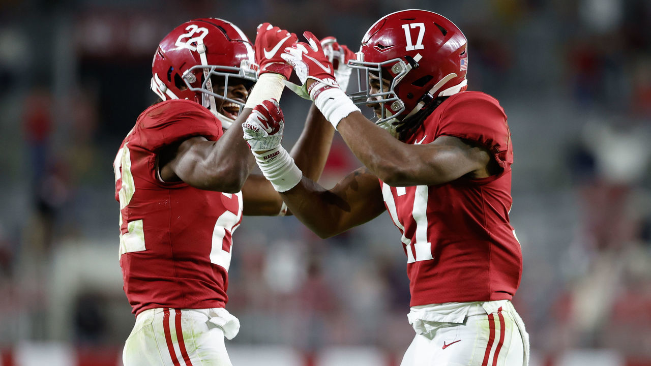 TUSCALOOSA, AL - OCTOBER 17: Jaylen Waddle #17 and Najee Harris #22 of the Alabama Crimson Tide celebrates running in a touchdown in the seond half against the Georgia Bulldogs at Bryant-Denny Stadium on October 17, 2020 in Tuscaloosa, Alabama.