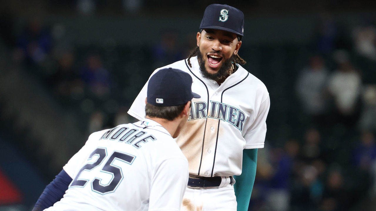 SEATTLE, WASHINGTON - APRIL 19: J.P. Crawford #3 celebrates an out made by Dylan Moore #25 of the Seattle Mariners to end the top of the seventh inning against the Los Angeles Dodgers T-Mobile Park on April 19, 2021 in Seattle, Washington. 2