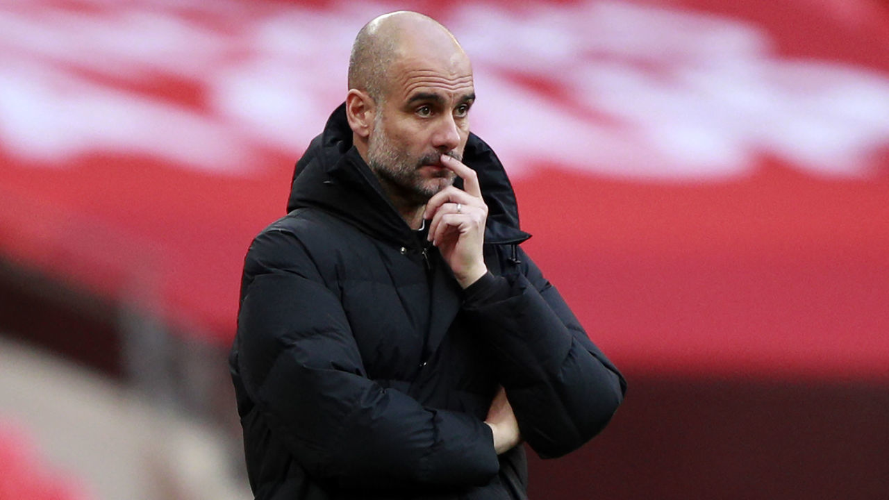 Manchester City's Spanish manager Pep Guardiola looks on during the English FA Cup semi-final football match between Chelsea and Manchester City at Wembley Stadium in north west London on April 17, 2021. - - NOT FOR MARKETING OR ADVERTISING USE / RESTRICTED TO EDITORIAL USE