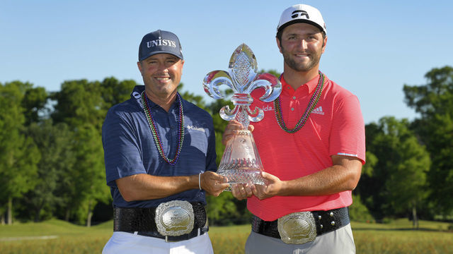 AVONDALE, LA - APRIL 28: Ryan Palmer and Jon Rahm pose with the winner's trophy on the 18th green during the final round of the Zurich Classic of New Orleans at TPC Louisiana on April 28, 2019 in Avondale, Louisiana.
