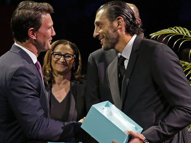 SUNRISE, FL - OCTOBER 13: Friend and Hockey Canada teammate Shane Doan presents Goaltender Roberto Luongo a gift in commemoration of playing in his 1000th NHL game prior to hosting the Vancouver Canucks at the BB&T Center on October 13, 2018 in Sunrise, Florida.