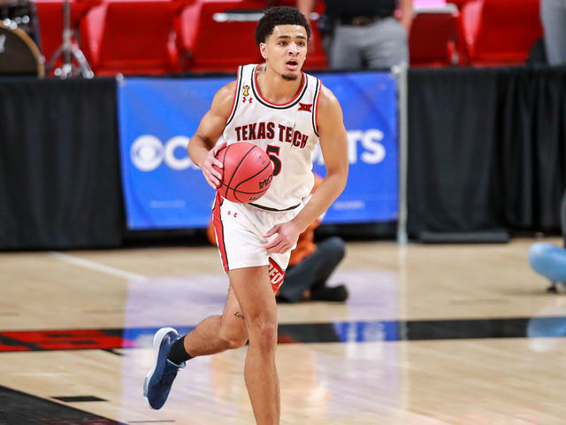 LUBBOCK, TEXAS - FEBRUARY 27: Guard Micah Peavy #5 of the Texas Tech Red Raiders handles the ball during the second half of the college basketball game against the Texas Longhorns at United Supermarkets Arena on February 27, 2021 in Lubbock, Texas.