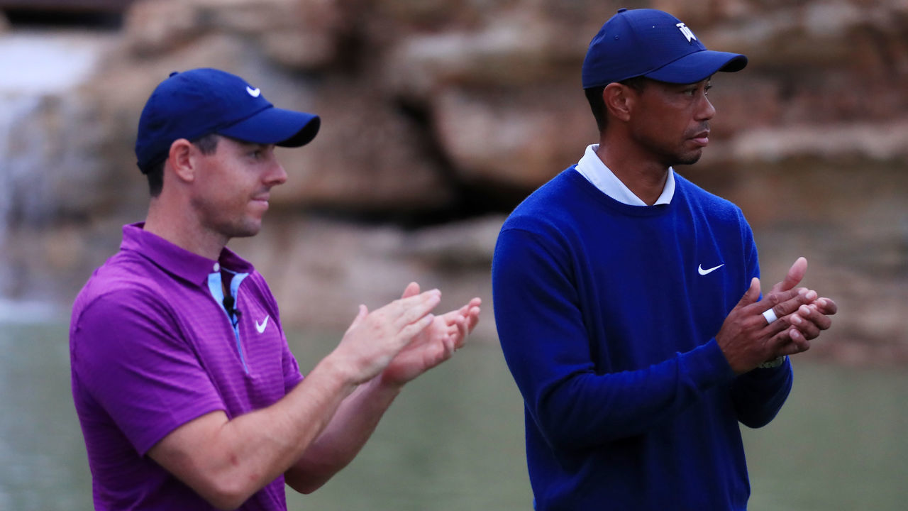 RIDGEDALE, MISSOURI - SEPTEMBER 22: Rory McIlroy of Northern Ireland and Tiger Woods of the United States clap on the 19th green after defeating Rory McIlroy of Northern Ireland and Justin Rose of England in the Payne’s Valley Cup on September 22, 2020 on the Payne’s Valley course at Big Cedar Lodge in Ridgedale, Missouri.