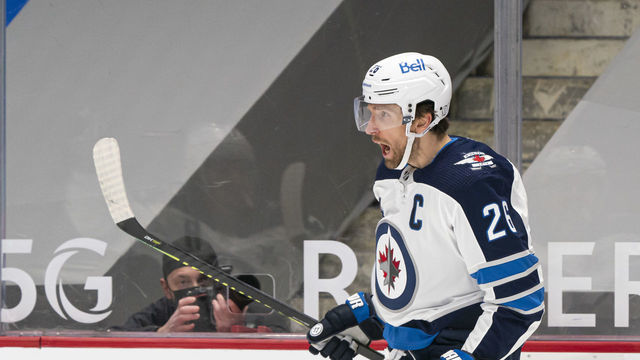 VANCOUVER, BC - MARCH 22: Blake Wheeler #26 of the Winnipeg Jets celebrates after scoring a goal during NHL action against the Vancouver Canucks at Rogers Arena on March 22, 2021 in Vancouver, Canada.
