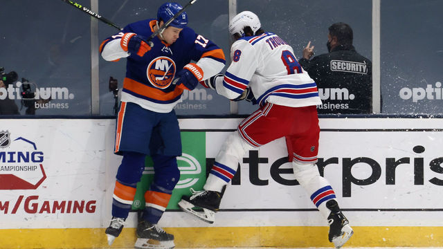 UNIONDALE, NEW YORK - APRIL 20: Jacob Trouba #8 of the New York Rangers left the game following this first period hit by Matt Martin #17 of the New York Islanders at the Nassau Coliseum on April 20, 2021 in Uniondale, New York.