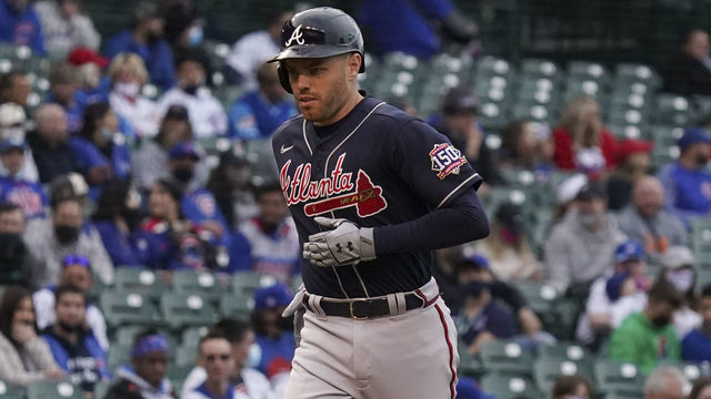 CHICAGO, ILLINOIS - APRIL 18: Freddie Freeman #5 of the Atlanta Braves hits a home run during the first inning of a game against the Chicago Cubs at Wrigley Field on April 18, 2021 in Chicago, Illinois.