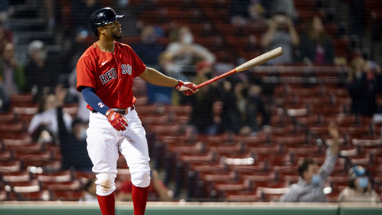BOSTON, MA - APRIL 20: Xander Bogaerts #2 of the Boston Red Sox hits a three run home run during the fourth inning of a game against the Toronto Blue Jays on April 20, 2021 at Fenway Park in Boston, Massachusetts.