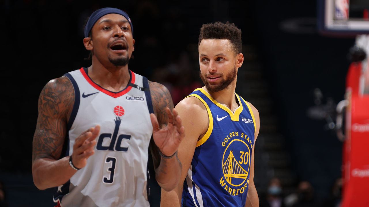 WASHINGTON, DC - APRIL 21: Bradley Beal #3 of the Washington Wizards and Stephen Curry #30 of the Golden State Warriors looks on during the game on April 21, 2021 at Capital One Arena in Washington, DC. Mandatory Copyright Notice: Copyright 2021 NBAE