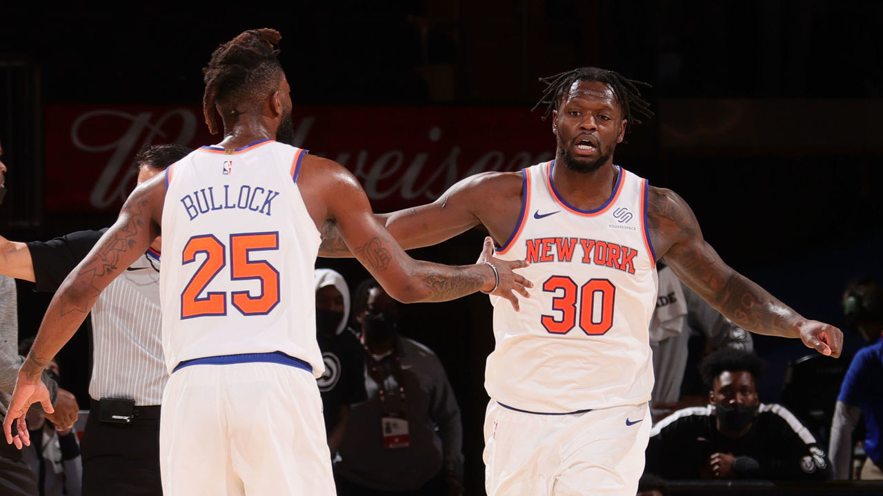 NEW YORK, NY - APRIL 21: Julius Randle #30 of the New York Knicks high-fives teammate Reggie Bullock #25 during the game against the Atlanta Hawks on April 21, 2021 at Madison Square Garden in New York City, New York. Mandatory Copyright Notice: Copyright 2021 NBAE