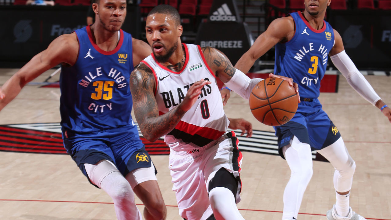PORTLAND, OR - APRIL 21: Damian Lillard #0 of the Portland Trail Blazers drives to the basket during the game against the Denver Nuggets on April 21, 2021 at the Moda Center Arena in Portland, Oregon. Mandatory Copyright Notice: Copyright 2021 NBAE