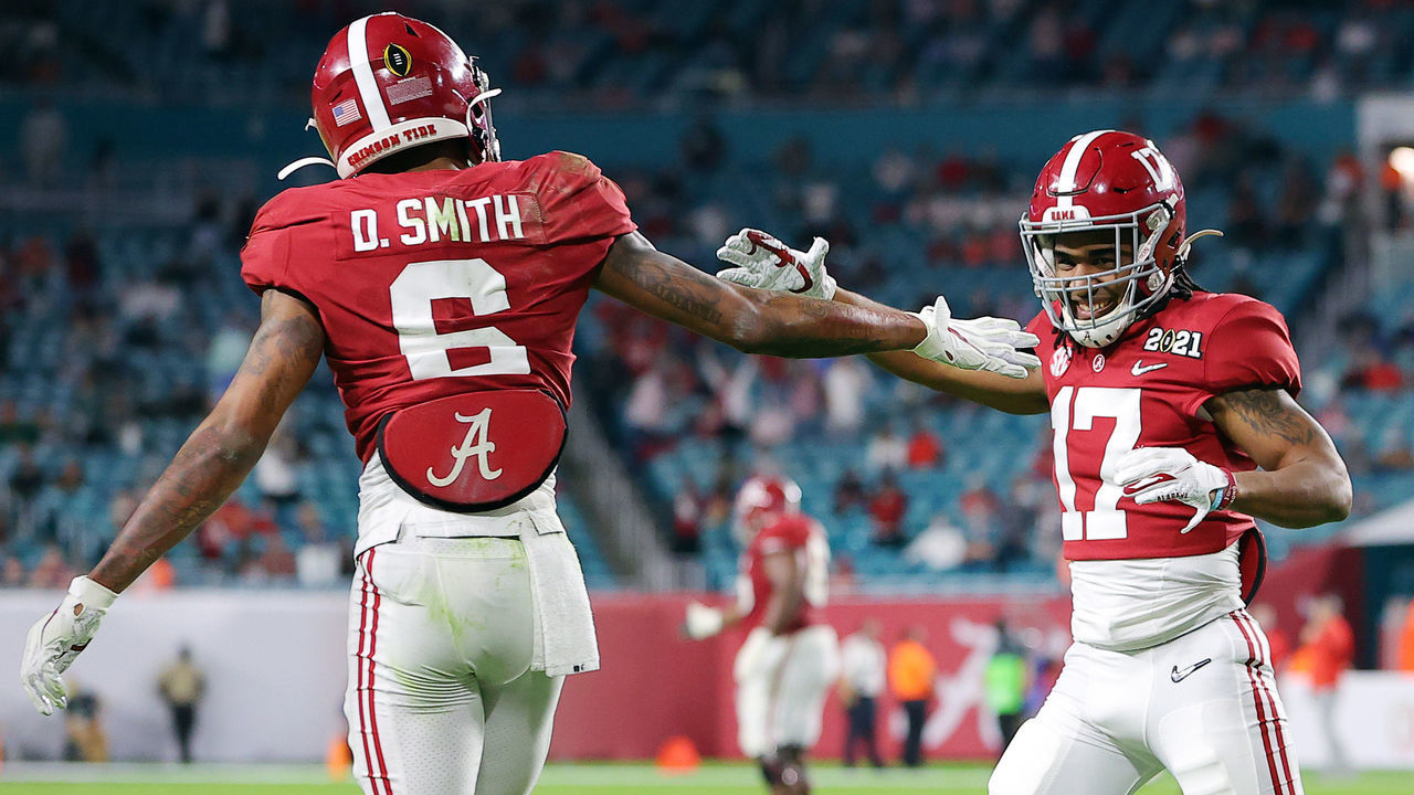 MIAMI GARDENS, FLORIDA - JANUARY 11: DeVonta Smith #6 of the Alabama Crimson Tide celebrates his touchdown with Jaylen Waddle #17 during the second quarter of the College Football Playoff National Championship game against the Ohio State Buckeyes at Hard Rock Stadium on January 11, 2021 in Miami Gardens, Florida.