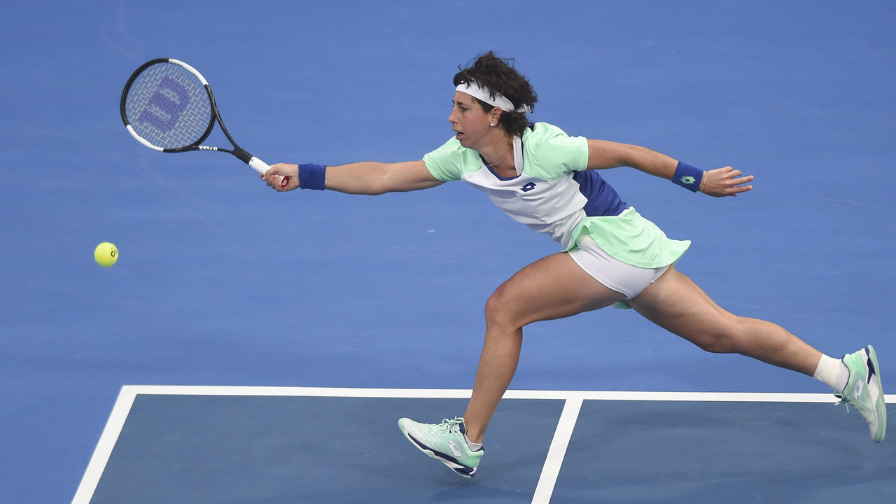 DOHA, Feb. 25, 2020 -- Carla Suarez Navarro of Spain hits a return during the women's singles second round match against Petra Kvitova of the Czech Republic at the 2020 WTA Qatar Open in Doha, Qatar, Feb. 25, 2020.