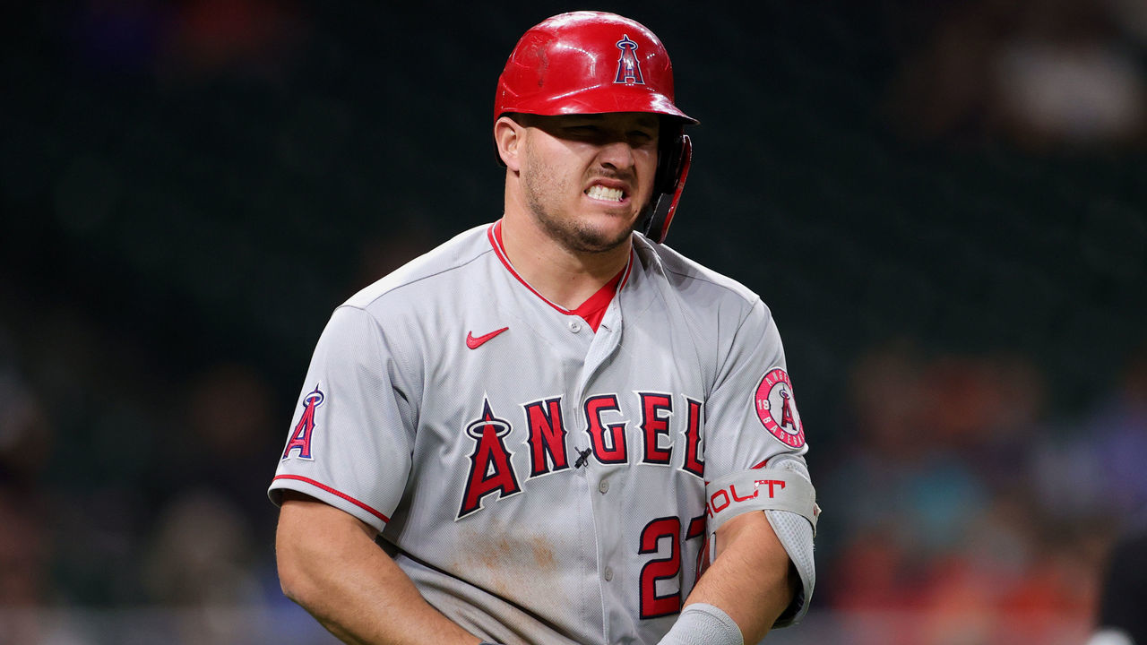 HOUSTON, TEXAS - APRIL 22: Mike Trout #27 of the Los Angeles Angels grimaces in pain after being hit by a pitch in the fourth inning by Cristian Javier of the Houston Astros at Minute Maid Park on April 22, 2021 in Houston, Texas.