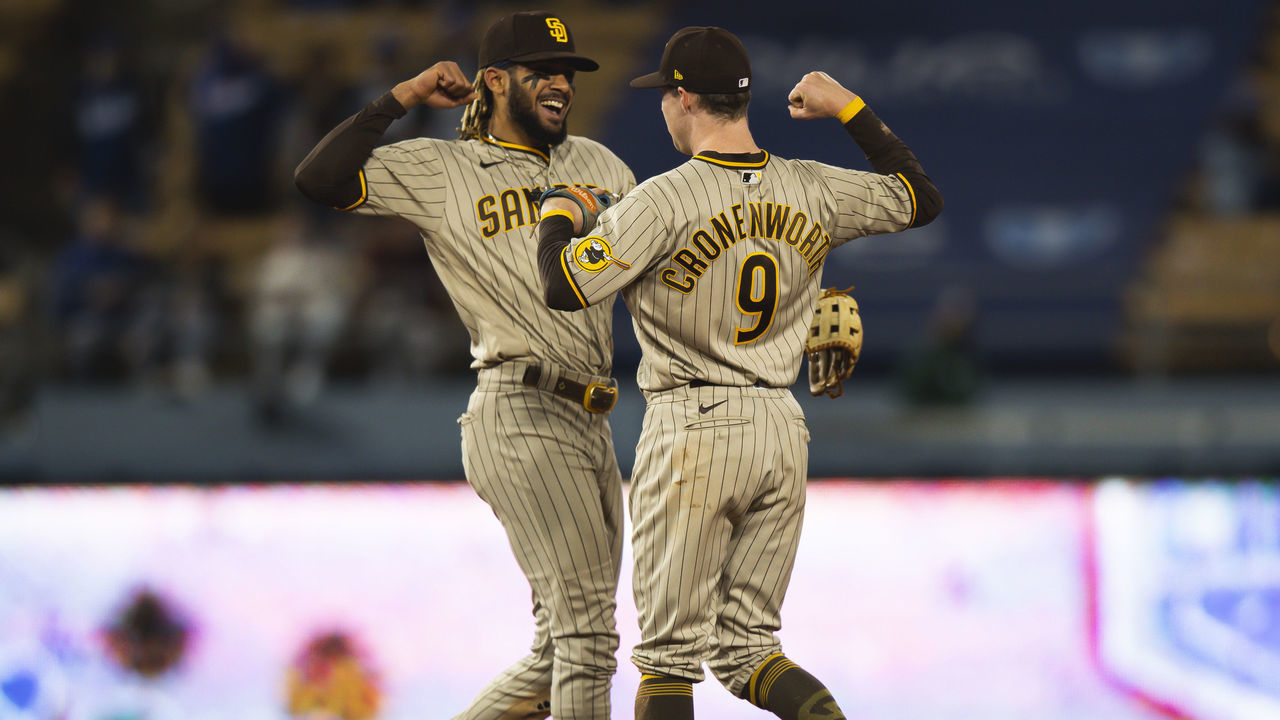 LOS ANGELES, CA - APRIL 22: Fernando Tatis Jr. #23 and Jake Cronenworth #9 of the San Diego Padres celebrate after defeating the Los Angeles Dodgers on April 22, 2021 at Dodger Stadium in Los Angeles, California.