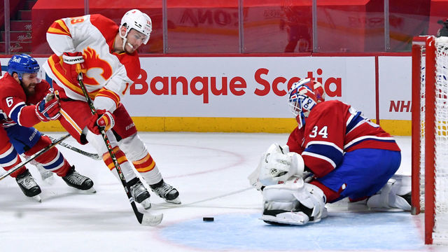 MONTREAL, QC - APRIL 16: Matthew Tkachuk #19 of the Calgary Flames misses the net against Jake Allen #34 of the Montreal Canadiens in the NHL game at the Bell Centre on April 16, 2021 in Montreal, Quebec, Canada.